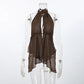 A Kaelen boho chiffon halter top in deep brown, featuring a keyhole cutout at the bust, a backless design, and a flowy, asymmetrical layered hem. Shown on a mannequin against a white studio background.