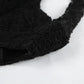Close-up of black floral lace fabric on the Kaelen Elegant Lace Mini Dress, showcasing its intricate openwork texture and delicate details.