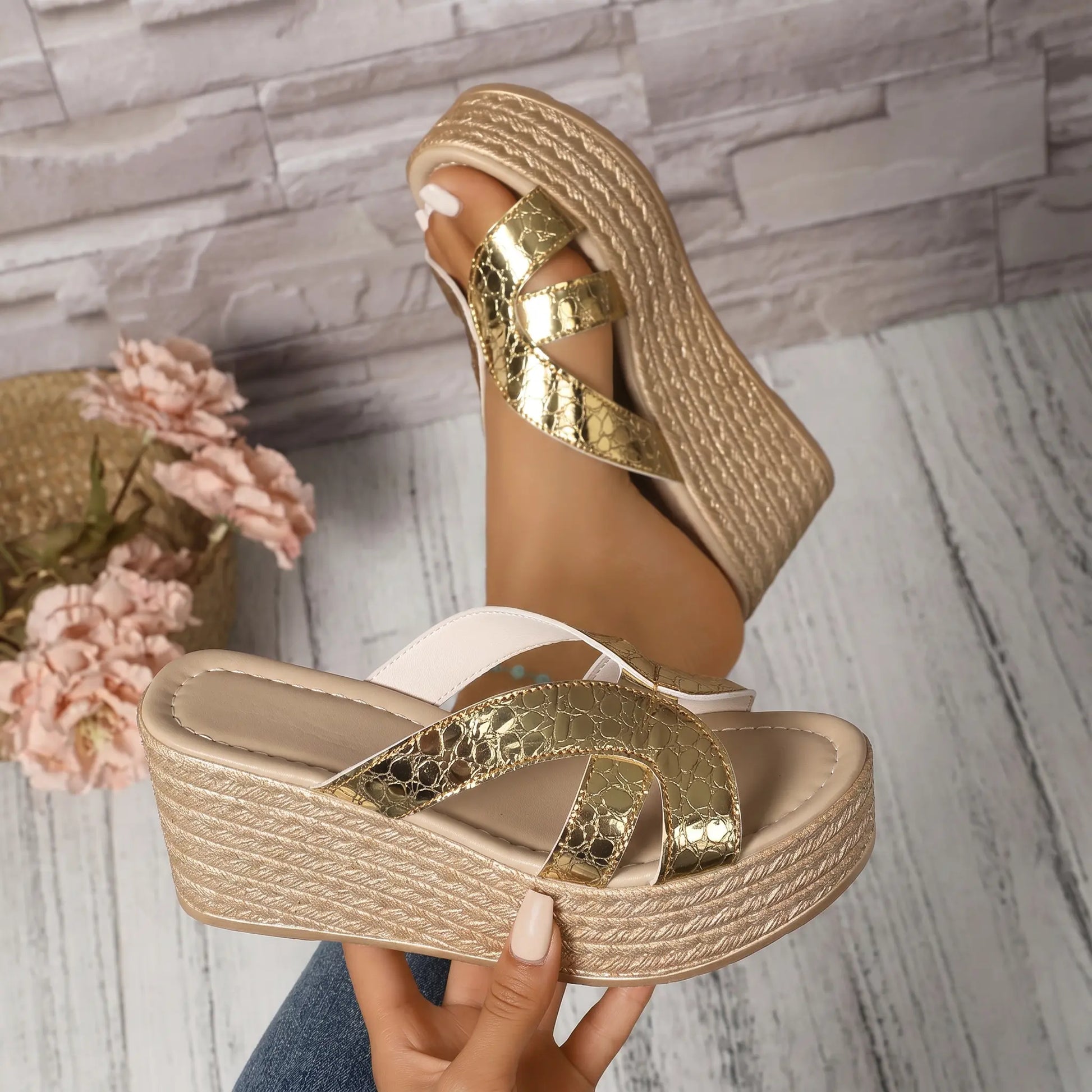 Kaelen champagne gold cracked metallic espadrille wedge sandals with a platform sole, shown from a three-quarter angle.
