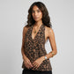 Kaelen sleeveless leopard print halter neck top with plunging V-neck, worn by a female model. Features smooth polyester fabric and decorative front buttons.