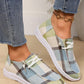 Kaelen comfortable canvas loafers with plaid pattern, featuring a blue, green, and beige woven textile, white laces, and a flat white rubber sole, worn on feet with jeans.