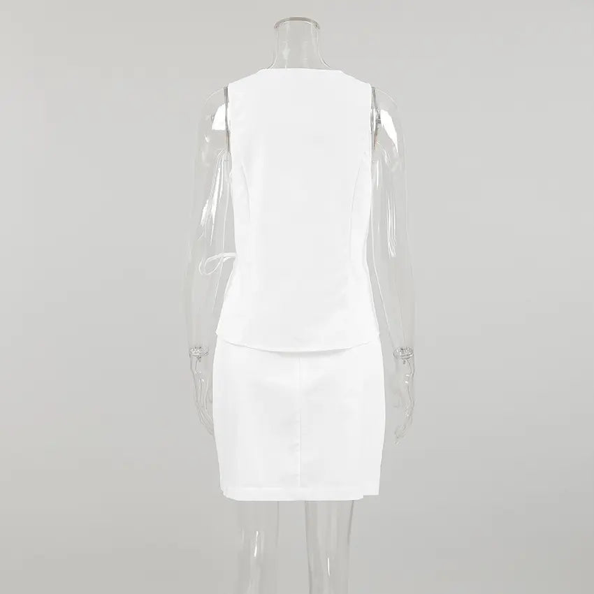 Back view of the Kaelen white linen-blend sleeveless wrap top and high-waisted A-line mini skirt set, showcasing the adjustable tie detail and clean silhouette.