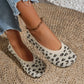 Women's Kaelen knit ballet flats in a leopard print, shown on a person's feet with distressed denim jeans and a gold ankle bracelet.