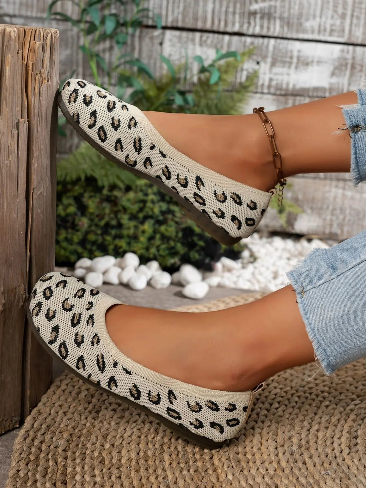 Women's Kaelen leopard print knit ballet flats, showcasing a comfortable slip-on design with a creamy off-white base and black/brown spots, styled with denim.