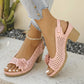 Kaelia Rose Petal chunky heel sandals with floral embellishments and perforated square pattern, shown on a model's feet with light wash denim jeans.