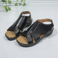 Kaelin black faux leather platform wedge sandals featuring a peep-toe design, adjustable ankle strap, and contrasting white stitching.