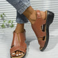 Front view of brown faux leather Kaelin platform wedge sandals worn by a model, showcasing the peep-toe design, adjustable ankle strap, and white contrast stitching on the wedge sole.