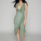 Kaelis women's sleeveless green lace midi dress featuring a deep V-neckline with cascading ruffles and an asymmetrical tiered ruffle hem, shown from the front.