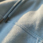 Kaelo premium cropped hoodie in soft-touch fleece — close-up detail showing fabric texture, reinforced stitching, and metal-tipped drawstrings.