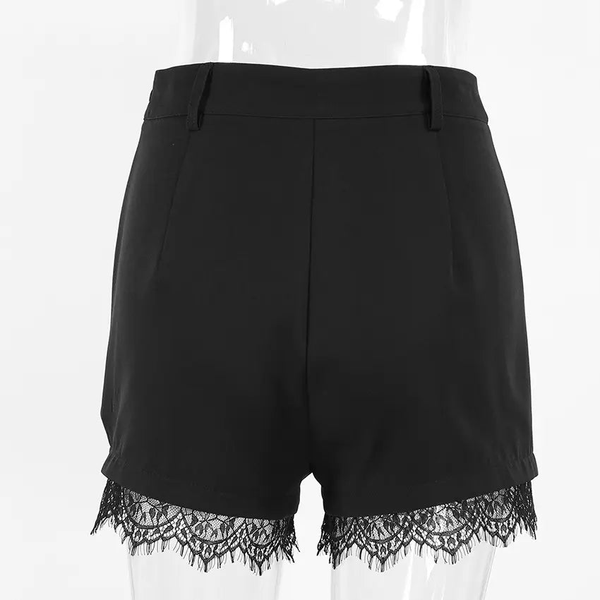 Back view of Kaelon black high-waisted shorts featuring elegant floral lace trim along the hem, displayed on a mannequin against a white studio background.