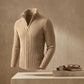 Kaelon architectural ribbed knit zip cardigan in beige for men — three-quarter view showing stand collar, metal zipper, and vertical thermal texture.