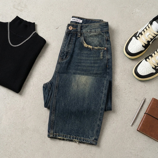 Kaelos high waisted wide leg jeans in vintage wash dark blue, flat lay outfit with black turtleneck and sneakers.