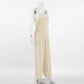 Side view of a Kaelum oatmeal beige linen blend wide leg jumpsuit with V-neck and spaghetti straps, displayed on a mannequin.