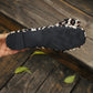 Close-up view of the bottom sole of Kaeluxe leopard print ballet flats, showcasing the textured rubber outsole and decorative bow detail.
