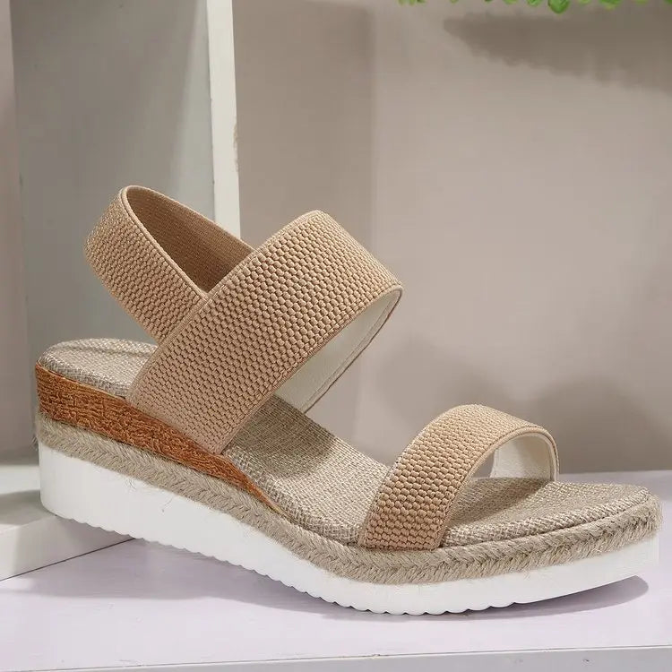 Natural khaki textured mesh espadrille wedge sandals for women, featuring elasticated straps, a peep-toe design, and a multi-layered platform with jute rope detailing.
