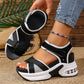 Women's black and grey woven textile platform sandals featuring a bow detail, adjustable hook-and-loop ankle strap, white layered EVA midsole, black rubber outsole, and a transparent air cushion heel.