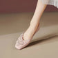 Blush Rose vegan leather square toe flats by Khyzet, adorned with delicate tonal floral appliques and pearl centers, worn on a foot.