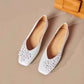 Overhead view of two Ivory Pearl Khyzet floral square toe flats, crafted from smooth vegan leather with delicate tonal appliques and pearl centers.