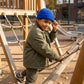 Kovari Docker Beanie fisherman hat in Cobalt Blue worn by a young boy climbing on a playground rope structure.