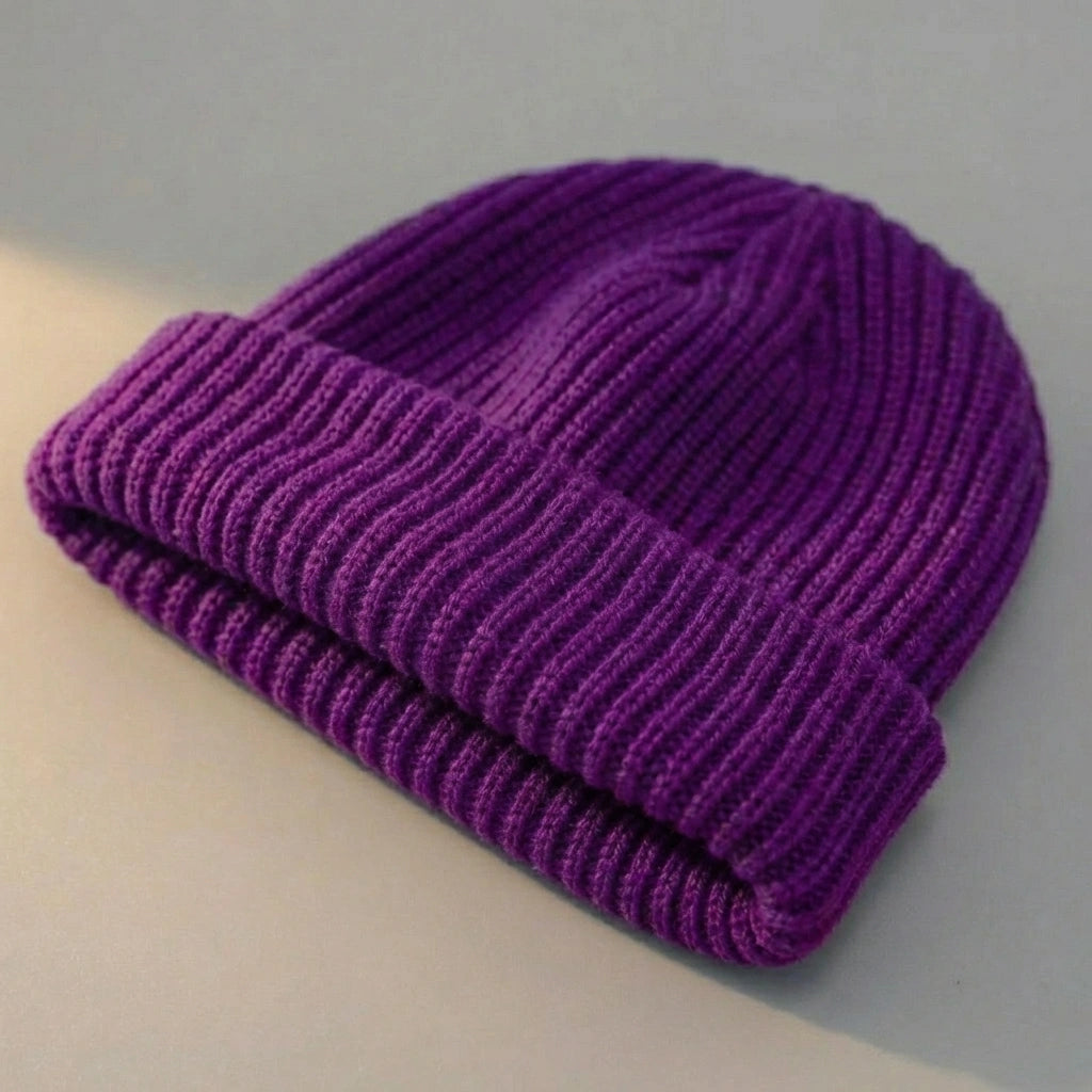 Kovari Docker Beanie fisherman hat in royal purple ribbed knit — three-quarter view showing the thick rolled cuff and vertical weave texture.