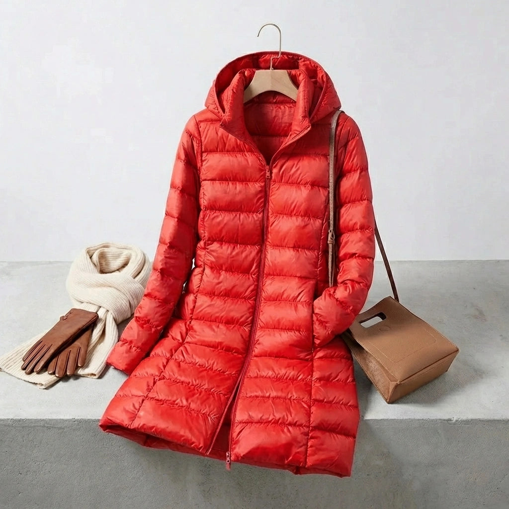 Kovera crimson red long puffer coat with removable hood and horizontal quilting, displayed with winter accessories.