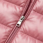 Close-up of the high-quality metallic zipper and soft rose pink quilted fabric on the Kovera slim fit long puffer coat.