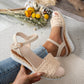 Bohemian beige crochet espadrille wedge sandals on a person's foot, showcasing the jute-wrapped wedge, adjustable ankle strap, and fish-mouth open toe.