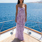 Model wearing a Zenthos Lilac Bloom Romantic Mesh Floral Maxi Dress with spaghetti straps and gathered bust, on a boat with ocean view.
