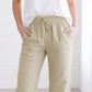 Luvana linen blend trousers in light khaki with an elastic waist and drawstring, shown from the front on a model.