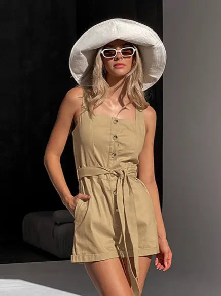 Mavrix women's oatmeal beige cotton belted wide-leg romper, featuring a square neckline, tank straps, and button-down front, styled with a large hat and sunglasses.