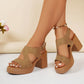 Women's tan suede-finish platform sandals with an open toe, V-cut forefoot straps, and a thick, ribbed block heel, shown on a model's feet with an ankle strap.