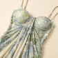 Close-up of a Zenthos green and blue botanical floral mesh maxi dress, showcasing the gathered sweetheart bodice, spaghetti straps, and ruched fabric.