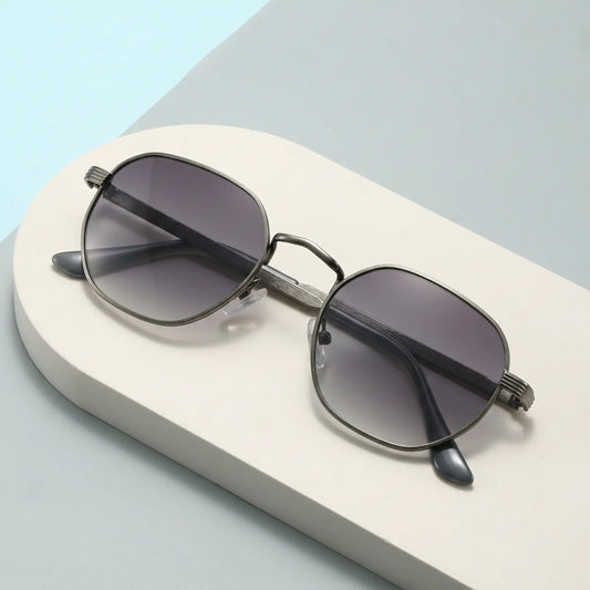 Chic Miroku octagonal metal sunglasses in gunmetal grey with gradient grey lenses and ribbed temple arms. These elegant unisex sunglasses feature a double bridge and black acetate tips, offering UV protection.