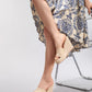 Miwazi light khaki beige woven espadrille wedge sandals, showcasing the braided raffia strap and 10.2cm jute wedge heel, elegantly worn on a model's foot.