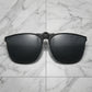 Nalani matte black metal square clip-on sunglasses with dark polarized lenses, front view on a clean white background.