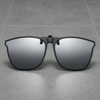 Matte black metal square clip-on sunglasses with grey polarized lenses, shown front-on against a clean white studio background.