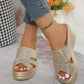 Nexaera metallic gold platform wedge sandals with a woven texture upper and peep-toe design, worn by a model with denim jeans.