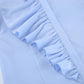 Close-up of a women's powder blue collared shirt showcasing asymmetrical ruffle detailing along the front placket and a smooth fabric texture.