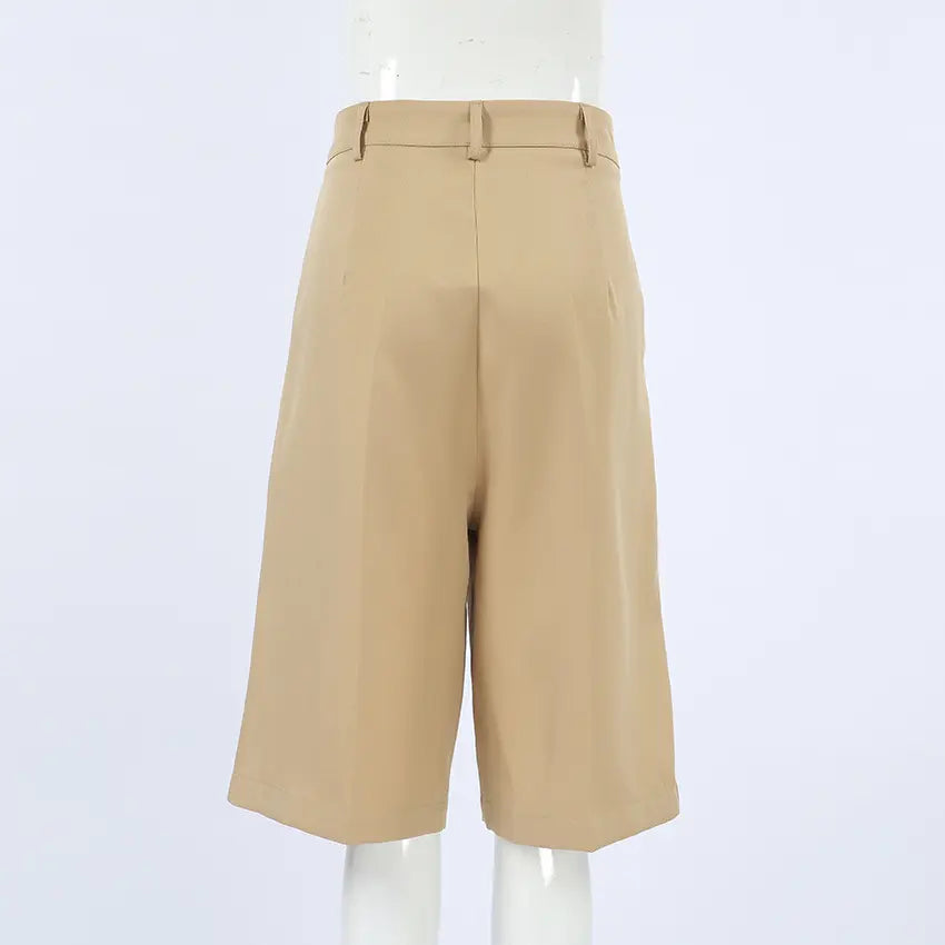 Back view of Rhyza tailored high-waist Bermuda shorts in khaki, featuring a wide leg, cuffed hem, and clean-finished waistband.