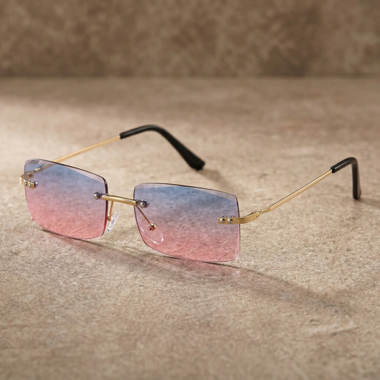 Rimless square-ish sunglasses with gradient pink and blue lenses, featuring a thin gold-tone metal bridge and slim metal temples with black acetate tips.