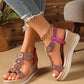 Bohemian embellished wedge sandals in shimmering rose gold with intricate circular rhinestone and bead details, shown on feet with distressed denim jeans. Features a woven espadrille-style sole and platform.