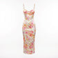 Roselle floral satin slip dress in cream with vintage rose print, featuring a structured corset-style bust and spaghetti straps — front view.