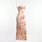 Roselle floral satin slip dress in cream with vintage rose print — three-quarter view showing structured corset bust and fluid bias-cut silhouette.
