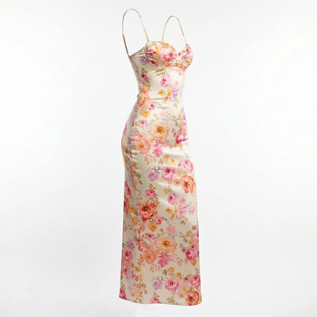 Roselle floral satin slip dress in cream with vintage rose print — three-quarter view showing structured corset bust and fluid bias-cut silhouette.
