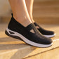 Ruxen Midnight Black woven slip-on sneakers worn on feet, detailing the breathable knit upper with triangular cutout, diamond perforations, and elegant white platform sole.