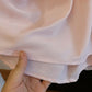Close-up of the Zhalis high-waisted floral maxi skirt's silky pink inner lining and double-stitched hem, highlighting premium craftsmanship.