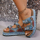 Platform slide sandals in sky blue, adorned with intricate beadwork and sequins on double straps, featuring polished silver buckles and a layered cork-effect sole with braided trim.