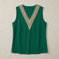 Sleeveless emerald green V-neck blouse with wide contrasting beige geometric crochet lace trim. Features clean armholes and a straight hem. Front view.