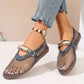 Women's Solarae elegant grey mesh flat sandals with a decorative polished buckle strap and patent trim, styled with distressed jeans and a beaded anklet.