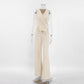 Tavrin women's beige linen-blend set featuring an asymmetrical sleeveless vest with button closure and matching wide-leg trousers. Shown front view on a mannequin.